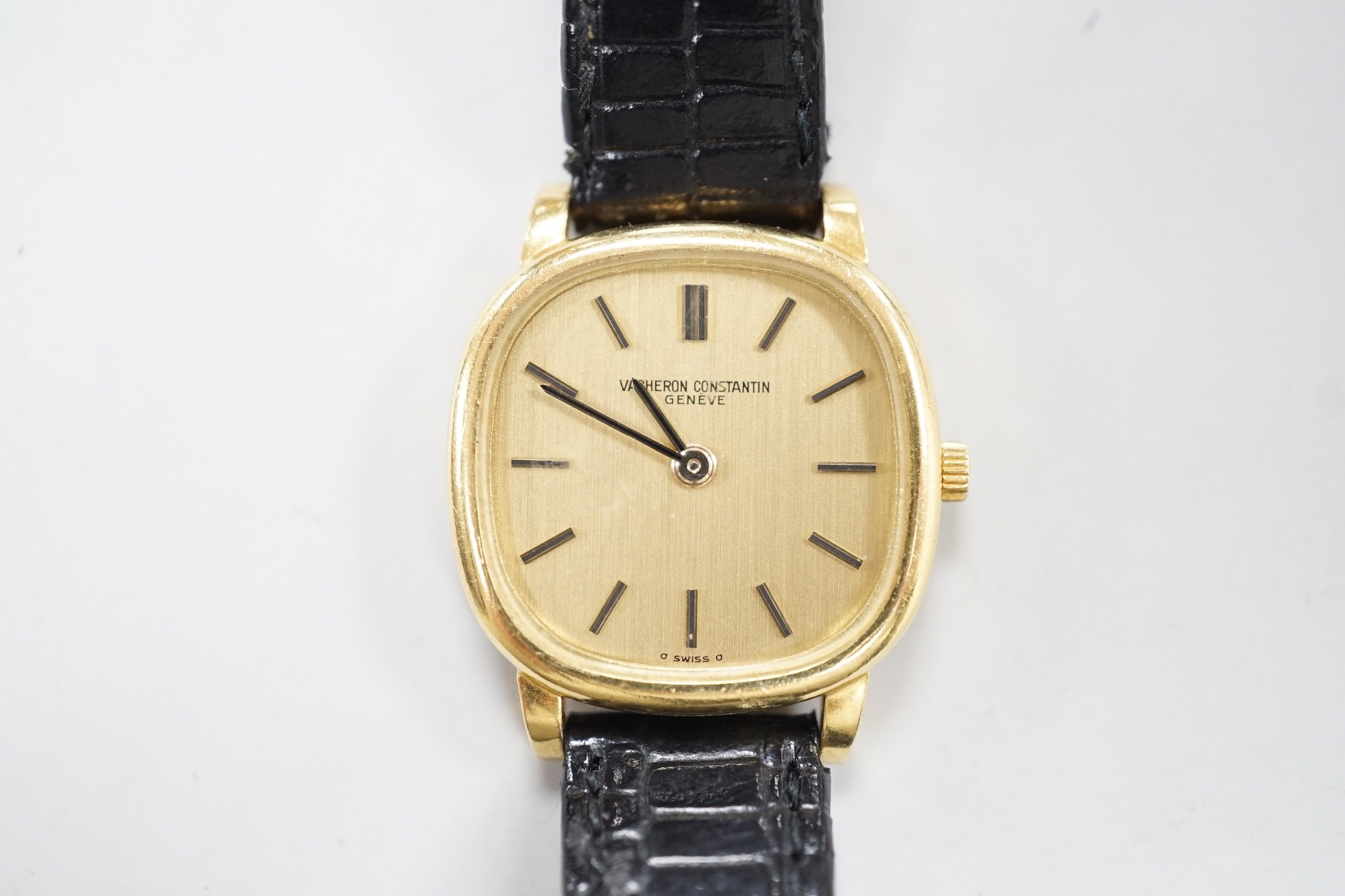 A lady's 18ct gold Vacheron & Constantin, manual wind wrist watch, on associated leather strap with 750 buckle, case diameter 23mm.